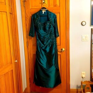 Dark teal satiny full length sleeveless evening gown with matching bolero jacket